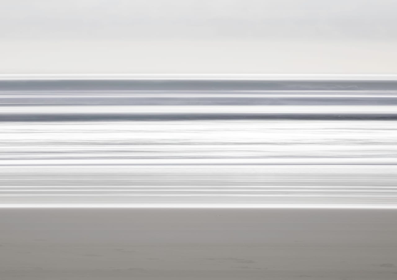 Abstract bands of grey and white surf along the Gold Coast.