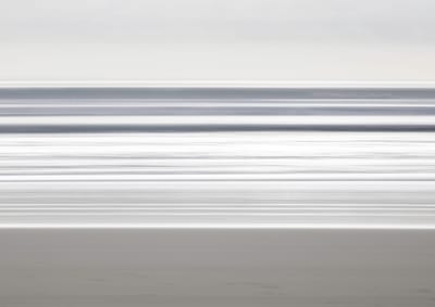 Abstract bands of grey and white surf along the Gold Coast.